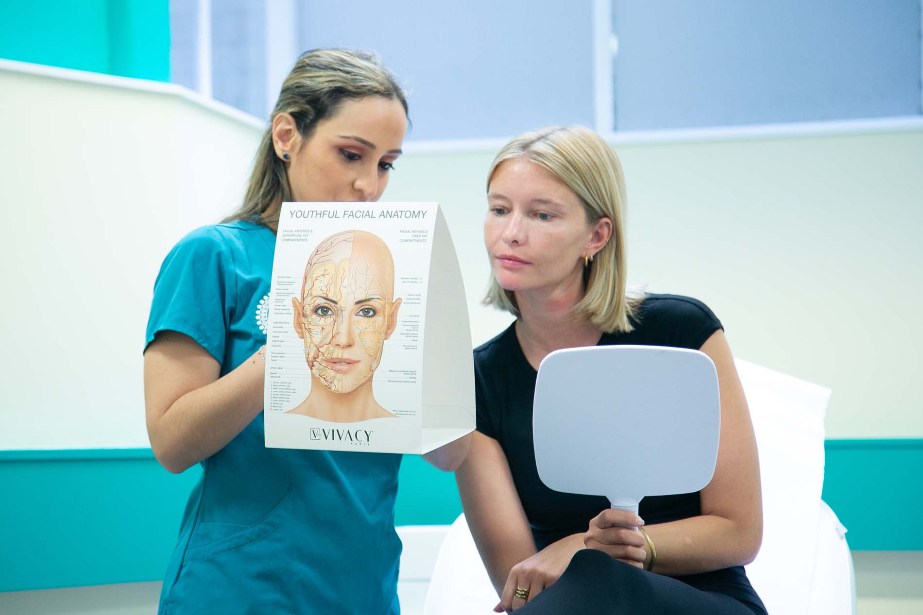 Dr Katherine talking a patient through her treatment plan at JK Aesthetics London